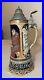 Tall-vintage-hand-painted-German-pottery-pewter-lidded-beer-stein-music-box-01-ktz